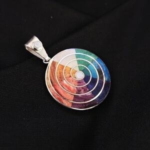 Peruvian 950 silver Pachamama pendant inlaid with semi-precious stones.